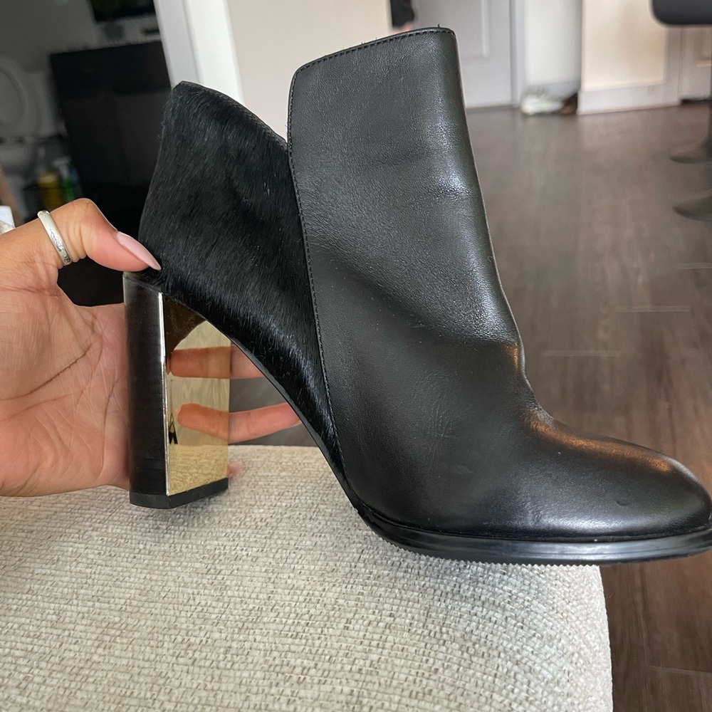 See by Chloe black leather bootie with gold inside heel